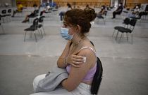 18 year old Idoia Casado waits after receiving the Pfizer COVID-19 vaccine during national COVID-19 vaccination campaign in Pamplona, northern Spain