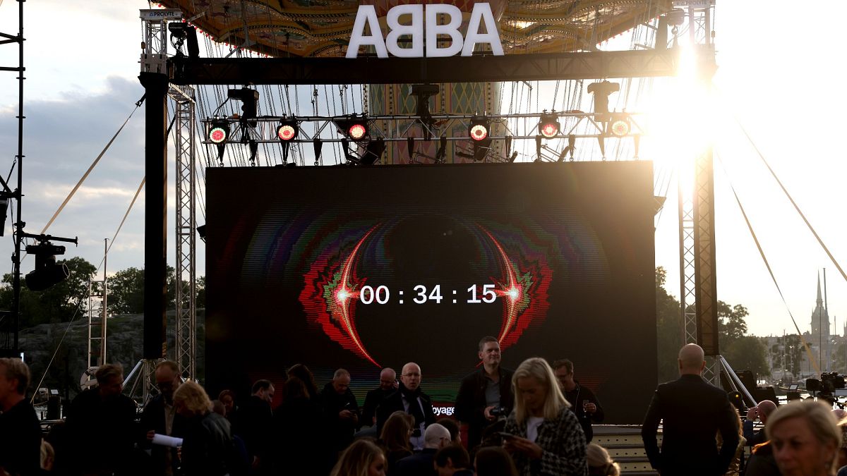 People look at the screen, at the ABBA Voyage event at Grona Lund, in Stockholm, Sweden, Sept. 2, 2021. 