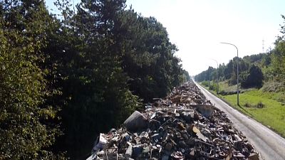 Waste piled up on the abandoned A601 motorway near Liege