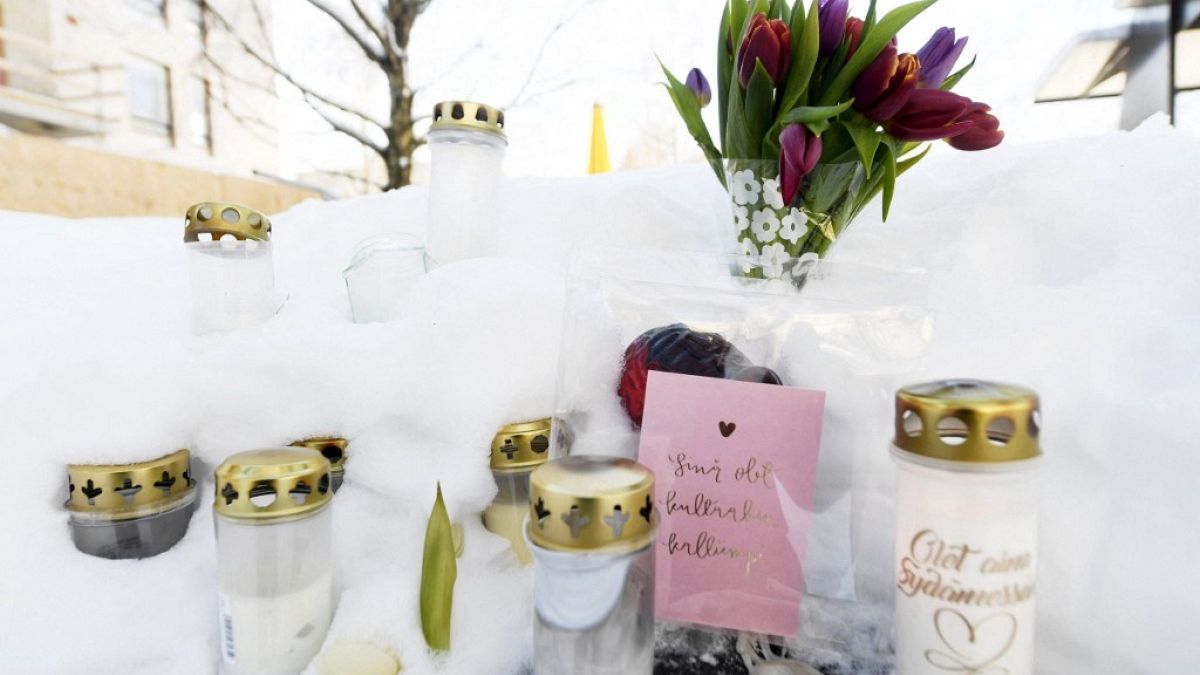 Candles, flowers and notes are placed in a park where the 16-year-old boy died.