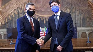US health secretary Secretary Xavier Becerra shakes hands with his Italian counterpart Roberto Speranza in Rome on 5 September 2021