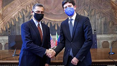 US health secretary Secretary Xavier Becerra shakes hands with his Italian counterpart Roberto Speranza in Rome on 5 September 2021