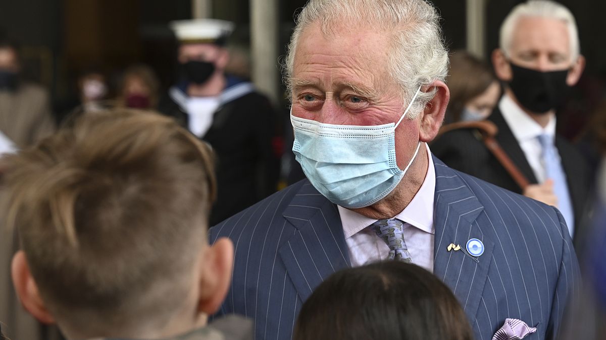 Britain's Prince Charles meets school children during a visit to Coventry Cathedral in Coventry, central England, May 25, 2021. 