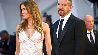 Antonio Banderas, right, and Nicole Kimpel pose for photograph upon arrival at the premiere of the film 'Official Competition' during the 78th Venice Film Festival.