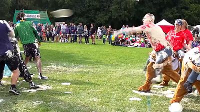 Competitors throwing 'custard' at each other.