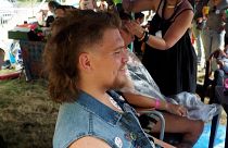 A Participant getting a mullet haircut at the European Mullet Cup Championship in the village of "Chéniers", in France's central Creuse region.