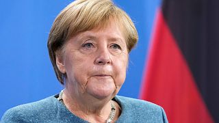 German Chancellor Angela Merkel attends a news conference with Austria's Chancellor Sebastian Kurz prior to a meeting at the chancellery in Berlin, Germany, Tuesday, Aug. 31.