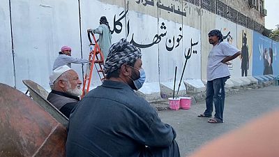 A mural being covered by Taliban /