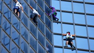 French Spider-Man' climbs Paris tower to protest COVID health pass |  Euronews