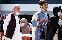 People evacuated from Afghanistan arrive at the Rome Leonardo da Vinci airport, Saturday, Aug. 28, 2021. People evacuated from Afghanistan arrive at the Rome Leonardo da Vinci airport, Saturday, Aug. 28, 2021.