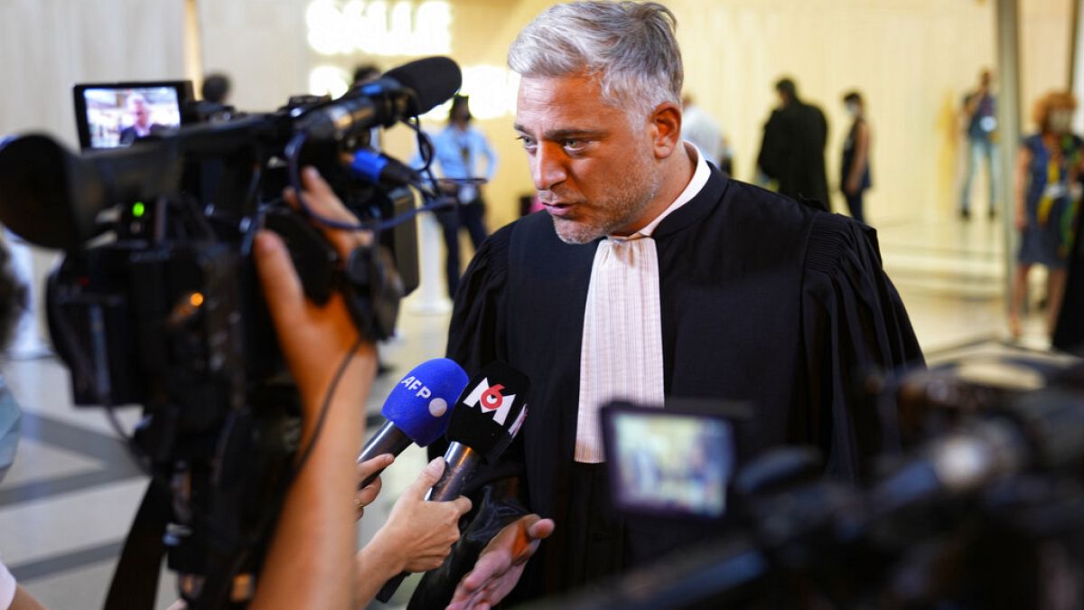 Xavier Noguerras, a lawyer for defendant Mohammed Amri, a suspected accomplice of Salah Abdeslam, answers reporters outside the special courtroom Wednesday, Sept. 8, 2021
