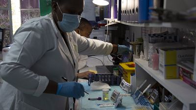 Laboratory technicians test a blood sample for HIV infection at the Reproductive Health and HIV Institute (RHI) in Johannesburg Laboratory technicians test a blood sample for HIV infection at the Reproductive Health and HIV Institute (RHI) in Johannesburg