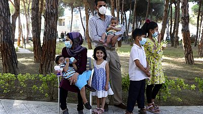 An Afghan family gather at a resort which is accommodated Afghan refugees in Golem, west of the capital Tirana. An Afghan family gather at a resort which is accommodated Afghan refugees in Golem, west of the capital Tirana.