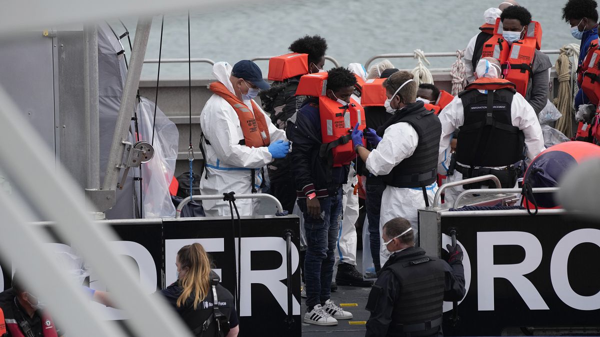 People thought to be migrants who made the crossing from Francedisembark in Dover after being picked up in the Channel by a British border force vessel, Aug. 13, 2021.
