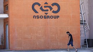 A logo adorns a wall on a branch of the Israeli NSO Group company, near the southern Israeli town of Sapir, Tuesday, Aug. 24, 2021.