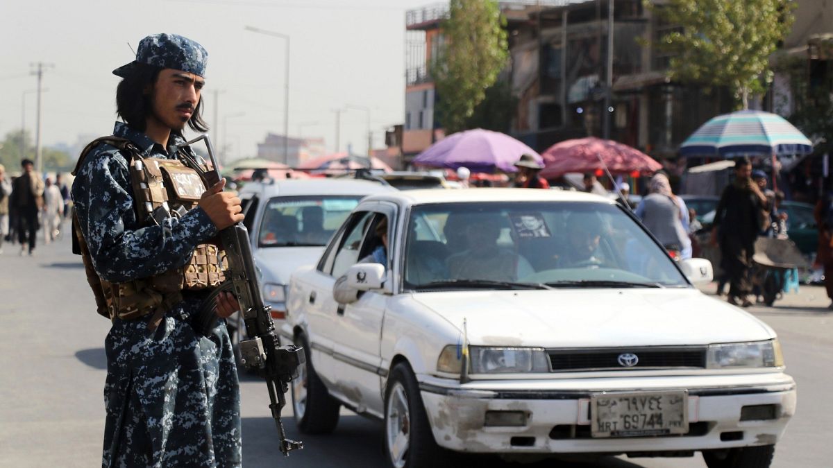Taliban fighter stand guards in the city of Kabul, Afghanistan, Saturday, Sept. 4, 2021. 