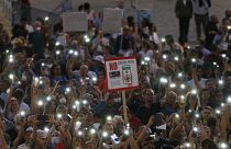 People stage a protest against the COVID-19 vaccination pass in Rome in July.