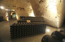 In this Wednesday, Oct. 16, 2013 photo, bottles of champagne are piled up inside the Veuve Clicquot Ponsardin cellars in Reims, eastern France
