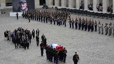 Republican Guards carry the coffin of Jean-Paul Belmondo after a tribute ceremony for the late French actor at the Hotel des Invalides.