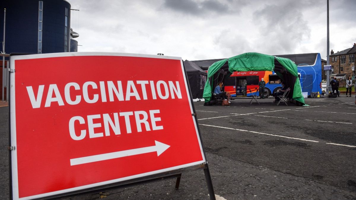 A sign points the way to the Scottish Ambulance Service vaccine bus in Glasgow on July 28, 2021.
