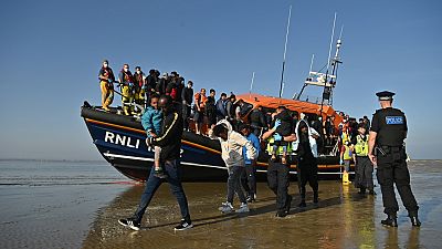 Migrants are escorted after being picked up by an RNLI (Royal National Lifeboat Institution) lifeboat while crossing the English channel, Dungeness, September 7, 2021.England Migrants are escorted after being picked up by an RNLI (Royal National Lifeboat Institution) lifeboat while crossing the English channel, Dungeness, September 7, 2021.England