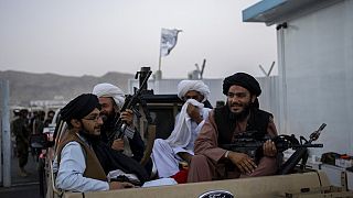 Taliban fighters sit in a pickup truck at the airport in Kabul, Afghanistan, Thursday, Sept. 9, 2021.