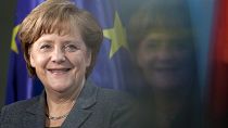 Chancellor Angela Merkel smiles during the presentation of a special edition of a two Euro coin at the chancellery in Berlin, Germany, on 9 February 2012.