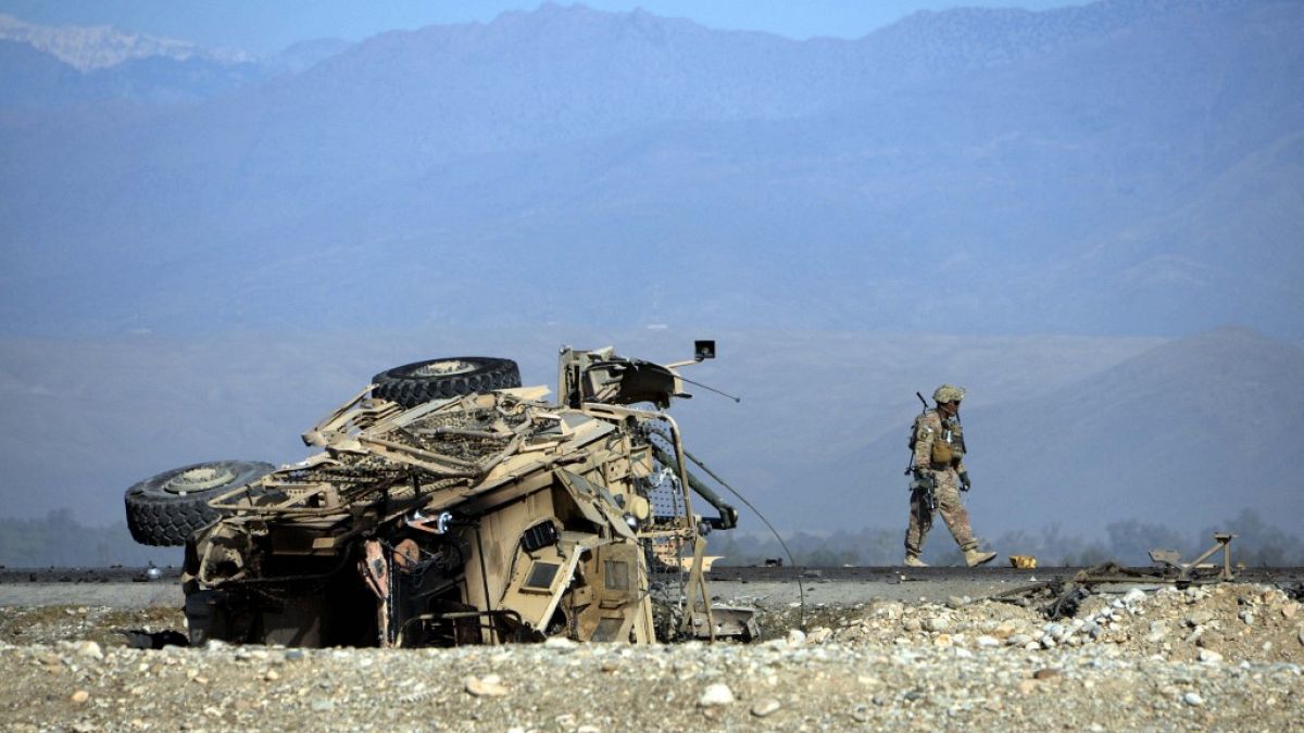 A US soldiers inspects the site of a suicide attack targeting foreign troops in Jalalabad on November 13, 2014.