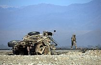 A US soldiers inspects the site of a suicide attack targeting foreign troops in Jalalabad on November 13, 2014.