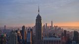 The Empire State Building and the 'Freedom Tower' are seen during sunset from the Rainbow Room in New York, on September 9, 2021.
