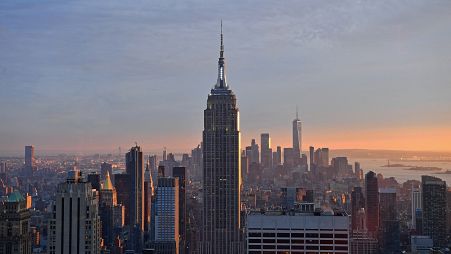 The Empire State Building and the 'Freedom Tower' are seen during sunset from the Rainbow Room in New York, on September 9, 2021.
