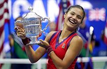 Emma Raducanu, of Britain, holds up the US Open championship trophy Saturday, Sept. 11, 2021, in New York, USA.