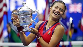 Emma Raducanu, of Britain, holds up the US Open championship trophy Saturday, Sept. 11, 2021, in New York, USA. 