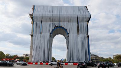 Wrapping of the Arc de Triomphe in Paris in silvery-blue fabric as a posthumous tribute to the artist Christo.