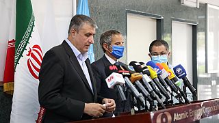 Head of the AEOI Mohammad Eslami delivering a speech next to Director General of the IAEA Rafael Grossi