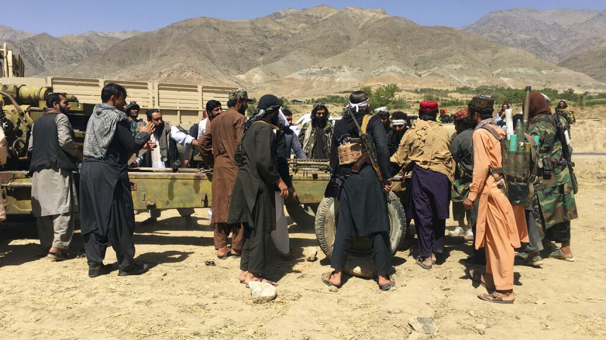 Taliban soldiers gather with weapons and machinery in Panjshir province northeastern of Afghanistan, Wednesday, Sept. 8, 2021.