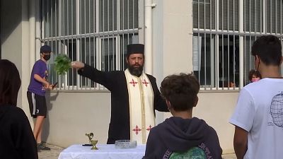 Orthodox priest offering blessing.
