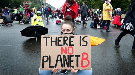 Young people attend a 'Fridays For Future' protest rally at the Brandenburg Gate in Berlin.