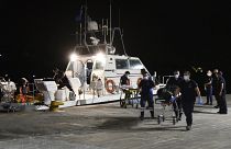 A coast guard vessel arrives with two bodies at Pythagorio port, on the eastern Aegean island of Samos.