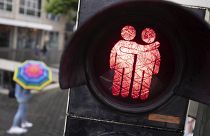 A stencil with a male couple can be seen at a traffic light system in Bielefeld, Germany.