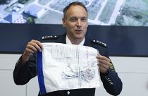 Police spokesman Thomas Geithner shows the remains of the metal foil of the balloon.