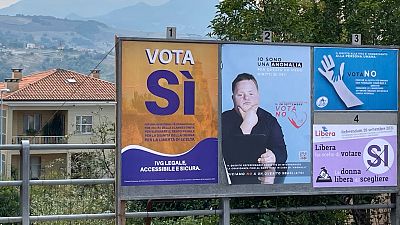 A view shows pro and anti-abortion campaign posters on September 10, 2021 in San Marino