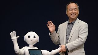 Softbank boss Masayoshi Son and Pepper the robot in 2014