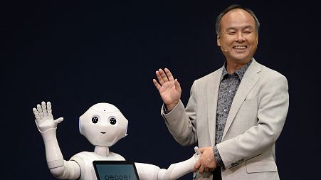 Softbank boss Masayoshi Son and Pepper the robot in 2014