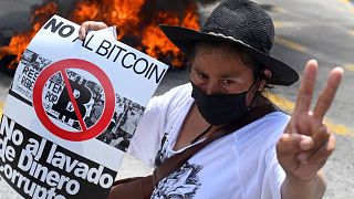 A demonstrator protests Bitcoin in San Salvador on Wednesday