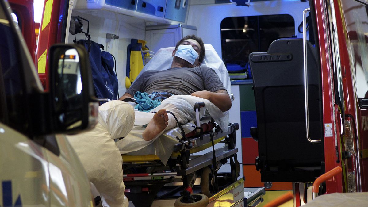 A man lays in an ambulance at the emergency service of the hospital in Papeete, Tahiti island, French Polynesia, Aug.20, 2021.
