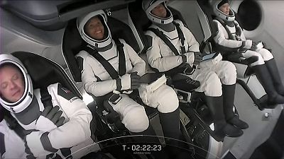 This screengrab taken from the SpaceX live webcast shows crew members.