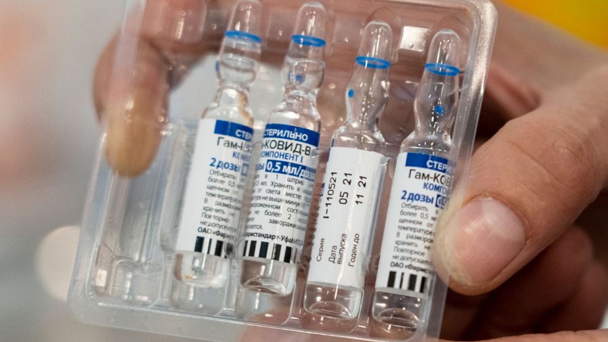A medical worker shows vials with Russia's Sputnik V coronavirus vaccine.
