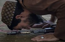 A Taliban fighter prays at a mosque during Friday prayers in Kabul.