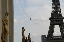French acrobat Nathan Paulin attempts to walk a highline from the Eiffel Tower across the Seine River.